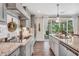Bright and airy kitchen with stainless steel appliances and modern countertops at 220 Alcovy Reserve Way, Covington, GA 30014