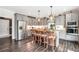 Modern kitchen featuring gray cabinetry, stainless steel appliances, and wood-look flooring at 220 Alcovy Reserve Way, Covington, GA 30014