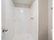 Bathroom shower with white tile and updated shower head at 2352 Rockwood Way, Stone Mountain, GA 30087