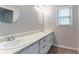 Bright bathroom featuring a double vanity with large mirror at 2352 Rockwood Way, Stone Mountain, GA 30087