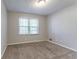 Simple bedroom with carpeting and a window allowing for great natural light at 2352 Rockwood Way, Stone Mountain, GA 30087