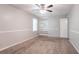 Bright bedroom with built in shelving and a ceiling fan at 2352 Rockwood Way, Stone Mountain, GA 30087