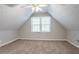 Bright bedroom featuring neutral walls, carpet floors, a ceiling fan, and natural light at 2352 Rockwood Way, Stone Mountain, GA 30087