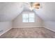Bright bedroom featuring neutral walls, carpet floors, a ceiling fan, and natural light at 2352 Rockwood Way, Stone Mountain, GA 30087