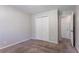 Cozy bedroom featuring neutral walls, carpet, and double door closet at 2352 Rockwood Way, Stone Mountain, GA 30087