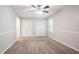 Well-lit bedroom featuring neutral walls and a double door closet at 2352 Rockwood Way, Stone Mountain, GA 30087