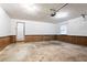 Attached garage with paneled walls, a white door, and an automatic garage door opener at 2352 Rockwood Way, Stone Mountain, GA 30087