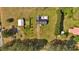 Aerial view of home with a pool, shed, and a large green lot surrounded by trees at 40 L Z Jackson Road, Bowdon, GA 30108