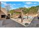 Backyard patio area with a pergola, pool, and an outdoor fireplace at 40 L Z Jackson Road, Bowdon, GA 30108