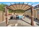 Backyard patio area with a pergola and an in-ground pool at 40 L Z Jackson Road, Bowdon, GA 30108