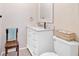 Bathroom showcasing a white vanity and toilet with natural accents at 40 L Z Jackson Road, Bowdon, GA 30108