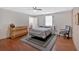 Bedroom with wood-look flooring, a ceiling fan, and a large rug at 40 L Z Jackson Road, Bowdon, GA 30108