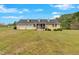 Charming home featuring a large front yard and a convenient two-car garage at 40 L Z Jackson Road, Bowdon, GA 30108