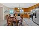 The kitchen features tile floors, a dining area, a stainless steel refrigerator, and plenty of cabinets at 40 L Z Jackson Road, Bowdon, GA 30108