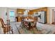 Eat-in kitchen with a large table, stainless steel appliances, tile floors, and ample cabinet space at 40 L Z Jackson Road, Bowdon, GA 30108