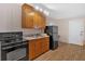 A kitchen with wooden cabinets, laminate counters, and modern appliances at 40 L Z Jackson Road, Bowdon, GA 30108