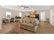 Spacious living room with hardwood floors, comfortable seating, and kitchen access at 40 L Z Jackson Road, Bowdon, GA 30108