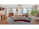 Inviting living room features wood floors, ceiling fan, and comfortable seating for relaxing and entertaining at 40 L Z Jackson Road, Bowdon, GA 30108