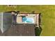 Aerial view of private pool and patio area, perfect for relaxing and entertaining in the backyard at 40 L Z Jackson Road, Bowdon, GA 30108