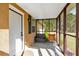 Cozy screened-in porch with comfortable seating, perfect for relaxation and enjoying the outdoors at 40 L Z Jackson Road, Bowdon, GA 30108