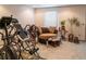Living room with exercise equipment, a sitting chair and an area rug at 9989 Village South Dr, Douglasville, GA 30135