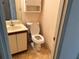Bathroom featuring a vanity, toilet, cabinet and patterned flooring at 1477 Springleaf Se Cir, Smyrna, GA 30080
