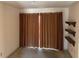 Bedroom area featuring closed curtains and wall shelving at 1477 Springleaf Se Cir, Smyrna, GA 30080