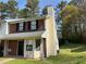 Charming two-story townhome with brick accents and a well-maintained front lawn at 1477 Springleaf Se Cir, Smyrna, GA 30080