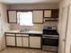 Traditional kitchen featuring white cabinets, stainless steel appliances, and a single bowl sink at 1477 Springleaf Se Cir, Smyrna, GA 30080