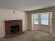 Spacious living room with a brick fireplace and natural light from a bay window at 1477 Springleaf Se Cir, Smyrna, GA 30080