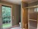 The bathroom features a shower with glass sliding doors and a large window at 3798 Lee Ridge Sw Way, Lilburn, GA 30047