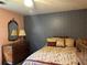 Cozy bedroom features soft lighting, a bed and a vintage-looking dresser at 3798 Lee Ridge Sw Way, Lilburn, GA 30047