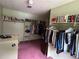 Walk-in closet features a wide selection of hanging clothes at 3798 Lee Ridge Sw Way, Lilburn, GA 30047