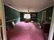 A large living room featuring green walls, purple carpet, large windows and baseboard trim at 3798 Lee Ridge Sw Way, Lilburn, GA 30047