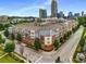 Overhead view of complex surrounded by trees, city skyline and a beautiful sunny sky at 400 17Th Nw St # 2125, Atlanta, GA 30363