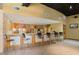 Stylish bar area with counter seating, colorful mural, and stainless steel appliances at 400 17Th Nw St # 2125, Atlanta, GA 30363