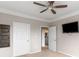 Bedroom featuring a fan, a TV, and doors that lead to other rooms in the house at 400 17Th Nw St # 2125, Atlanta, GA 30363