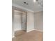 Entryway of a unit showing the front door with tile floor, wall trim, and neutral walls at 400 17Th Nw St # 2125, Atlanta, GA 30363