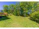 View of backyard with a small deck and mature trees at 4170 N Quail N Dr, Douglasville, GA 30135