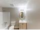 Bathroom featuring a shower/tub combo, toilet, sink with vanity, and mirror at 4170 N Quail N Dr, Douglasville, GA 30135