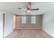 Bedroom with ceiling fan and two windows at 4170 N Quail N Dr, Douglasville, GA 30135
