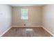 Empty bedroom with neutral carpet and window at 4170 N Quail N Dr, Douglasville, GA 30135