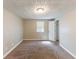 Bedroom featuring neutral carpet and a window at 4170 N Quail N Dr, Douglasville, GA 30135
