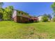 Exterior view of the home with brick and siding and a wood deck at 4170 N Quail N Dr, Douglasville, GA 30135