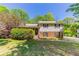 Charming two-story home featuring brick and siding with black shutters, a lawn and mature trees at 4170 N Quail N Dr, Douglasville, GA 30135