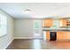 Kitchen featuring wooden cabinets, stainless steel appliances, and access to a back deck at 4170 N Quail N Dr, Douglasville, GA 30135