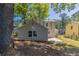 A spacious backyard with mature trees, offering ample space for relaxation and recreation at 5439 Farmview Close, Stone Mountain, GA 30088