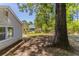 A spacious backyard with mature trees, offering ample space for relaxation and recreation at 5439 Farmview Close, Stone Mountain, GA 30088