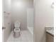 Bathroom featuring a toilet and shower-tub combo at 5439 Farmview Close, Stone Mountain, GA 30088