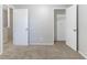 A bright bedroom with neutral carpeting and a closet, creating a cozy and functional space at 5439 Farmview Close, Stone Mountain, GA 30088
